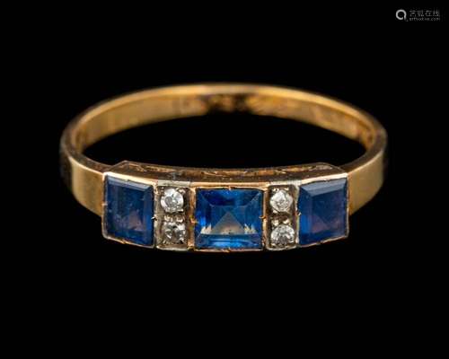 A sapphire and diamond ring,: set with three square cut sapp...