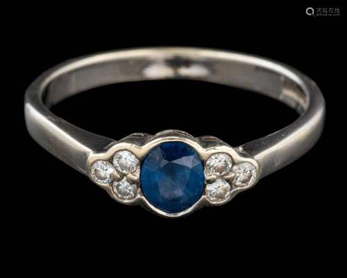 A 9 carat gold sapphire and diamond ring,: the oval cut sapp...