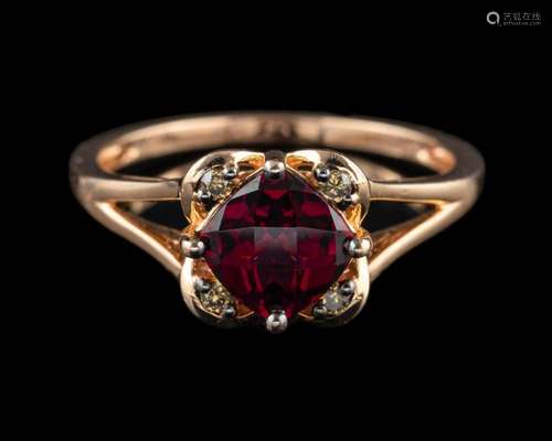 A garnet and diamond ring,: the cushion shaped garnets in a ...