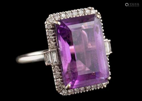 An 18 carat gold amethyst and diamond dress ring: the centra...