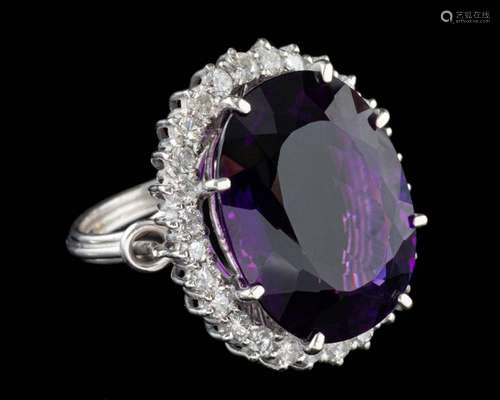 An amethyst and diamond dress ring,: the central oval cut am...