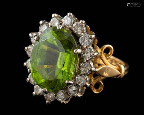 An 18 carat gold, peridot and diamond ring,