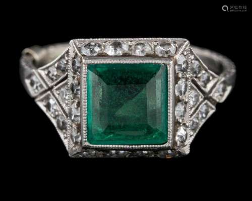 A 1920s emerald and diamond ring: the square cut emerald col...