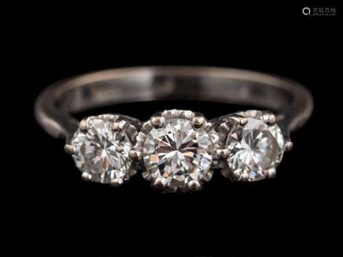 A diamond three stone ring,: set with three brilliant cut di...