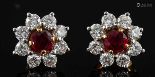 A pair of 18 carat gold ruby and diamond earrings by Garrard...