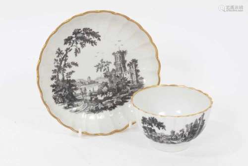 A Worcester fluted tea bowl and saucer, printed with ruins, ...