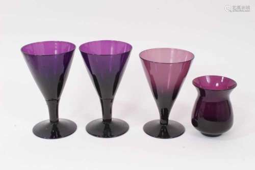 Three 19th century amethyst tinted flared glasses, and a sim...