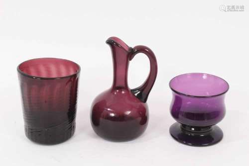 A 19th century amethyst tinted glass wrythen beaker, a small...