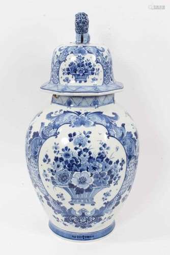 A large Dutch Delft blue and white vase and cover