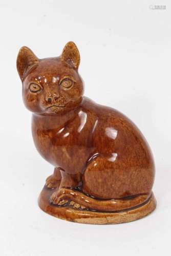 A lead glazed stoneware model of a cat, circa 1820