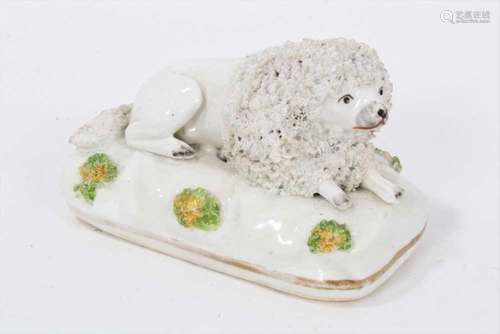 A Staffordshire porcelain model of a recumbent poodle, circa...