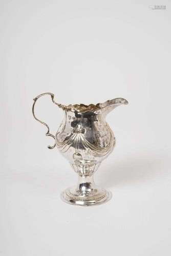 George III silver cream jug of baluster form, with raised sw...