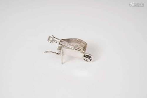 Contemporary silver novelty wheel barrow with fork, spade an...