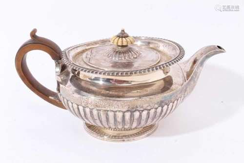 George IV silver teapot of squat melon form (London 1821), a...