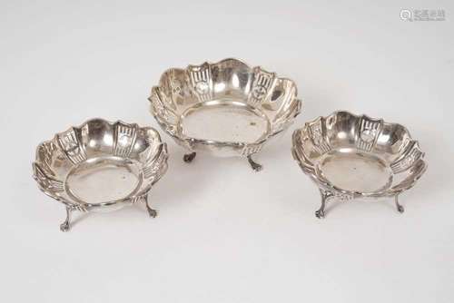 Matched set of two small and one larger, George V silver bon...