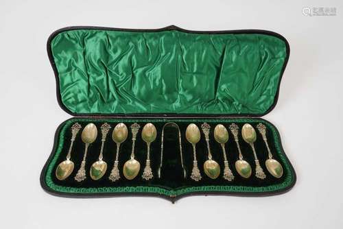 Set of twelve late Victorian silver gilt teaspoons and match...