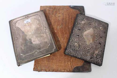 Two silver mounted desk blotters and a silver mounted statio...