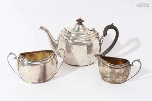 Silver teapot with matching silver sugar basin and silver cr...