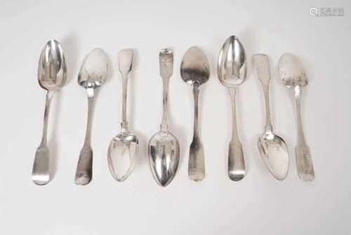 Eight Georgian Irish silver fiddle pattern serving spoons of...