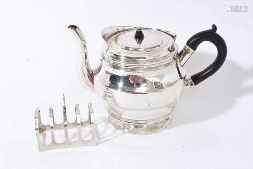 George III silver teapot together with a silver toast rack (...