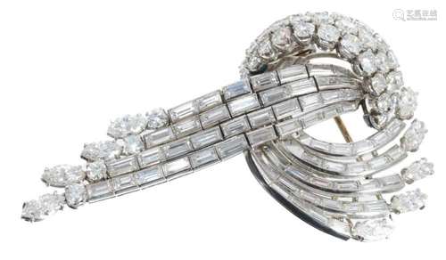 Diamond brooch with a stylized scroll and waterfall design w...