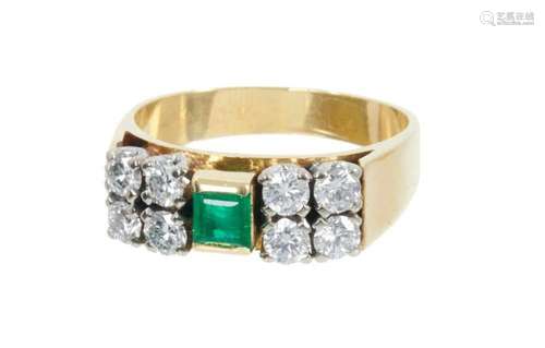 Emerald and diamond ring with a central step cut emerald and...