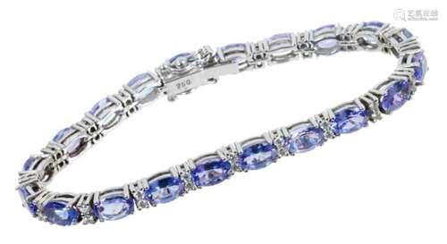 Tanzanite and diamond line bracelet in 18ct white gold setti...