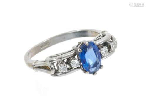 Sapphire and diamond ring with an oval mixed cut blue sapphi...