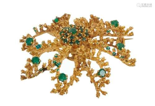 Gold and emerald brooch in the form of a stylised flower, st...