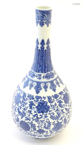 A Chinese blue and white bottle vase decorated with scrollin...