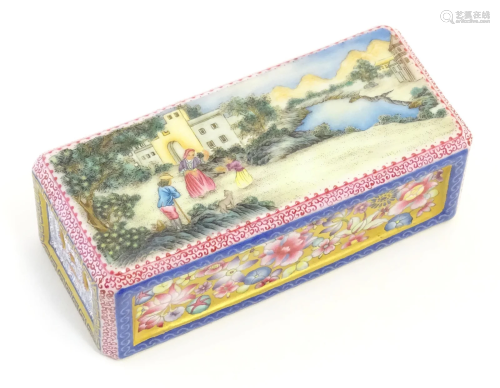 A Chinese famille rose paperweight decorated with a figures ...