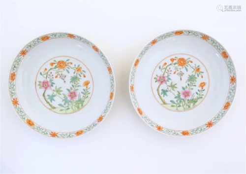 A pair of Chinese plates / dishes with central roundels depi...