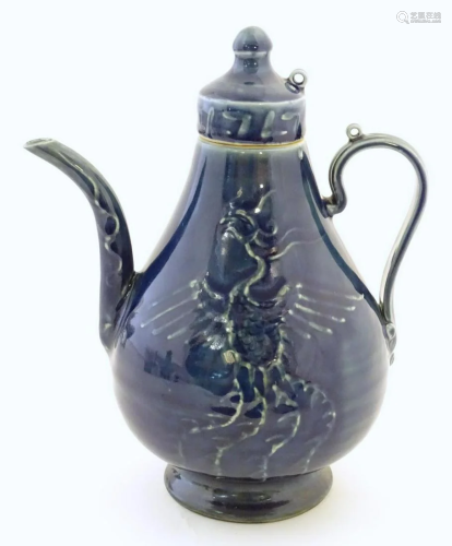 A Chinese pear shaped teapot with phoenix bird decoration to...