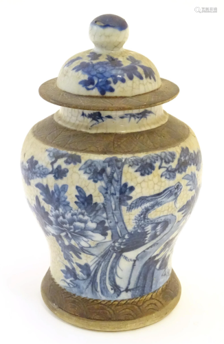 A Chinese blue and white ginger jar with a crackle glaze, th...
