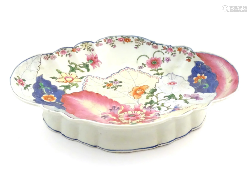 A Chinese export famille rose footed serving dish of lozenge...
