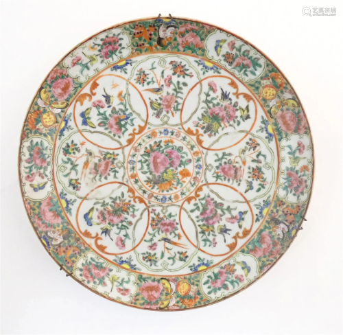 A Chinese / Cantonese famille rose charger decorated with fl...