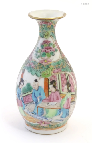 A Cantonese famille rose bottle vase with a flared rim decor...