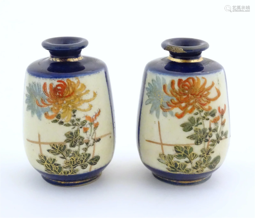 A pair of small Japanese vases decorated with chrysanthemum ...