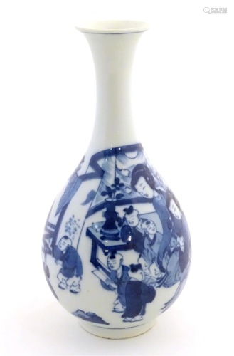 An Oriental blue and white bottle vase with a flared rim dec...