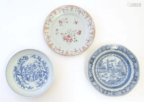 Two Chinese blue and white dishes, one decorated with a rive...