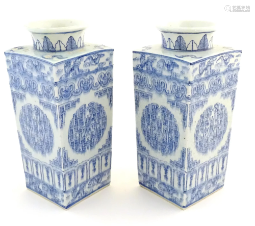 A matched pair of Chinese blue and white Cong shaped vases, ...