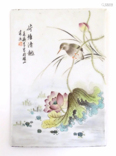 A Chinese porcelain plaque decorated with a bird perched on ...
