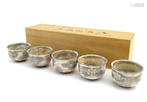 A set of five Japanese chawan / tea bowls decorated with flo...
