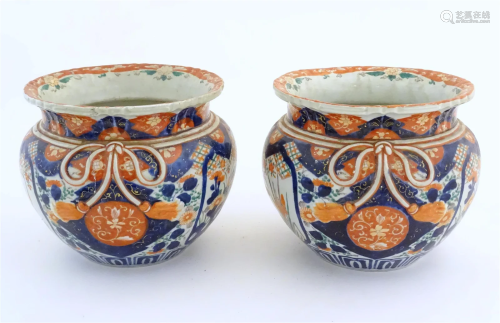 A pair of Oriental planters / jardinieres decorated in the I...