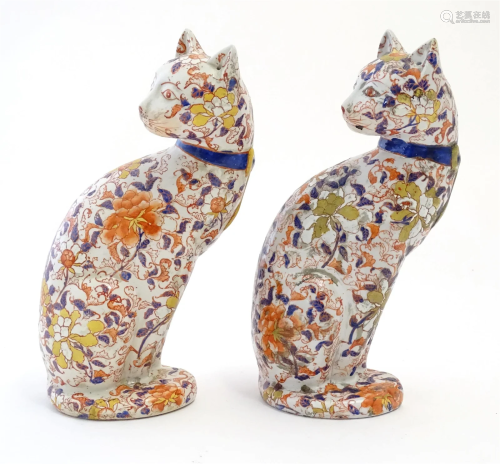 A pair of Oriental models of cats decorated in the Imari pal...