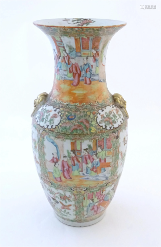 A Chinese famille rose vase with a flared rim and twin ring ...