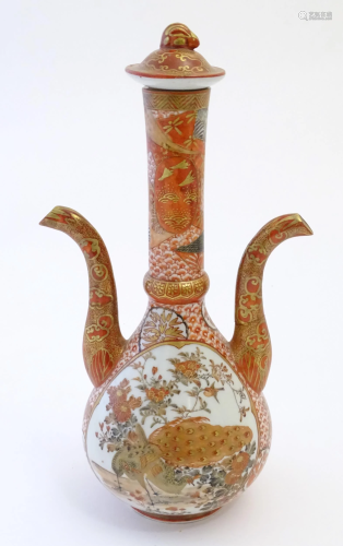 A Japanese Kutani lidded bottle vase with twin spouts decora...