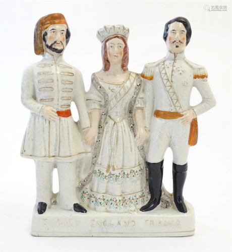 A Victorian Staffordshire pottery flat back figural group Tu...