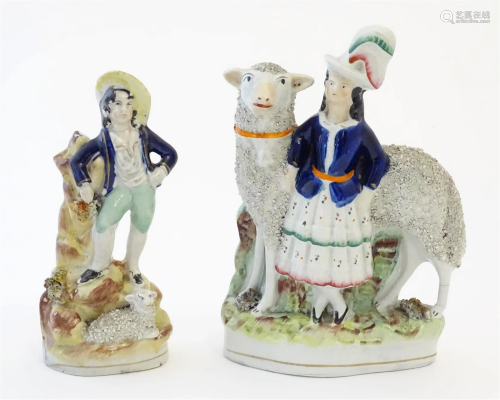 Two Victorian Staffordshire pottery figures depicting a girl...