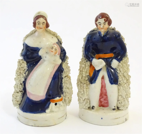 A pair of Victorian Staffordshire pottery figures depicting ...